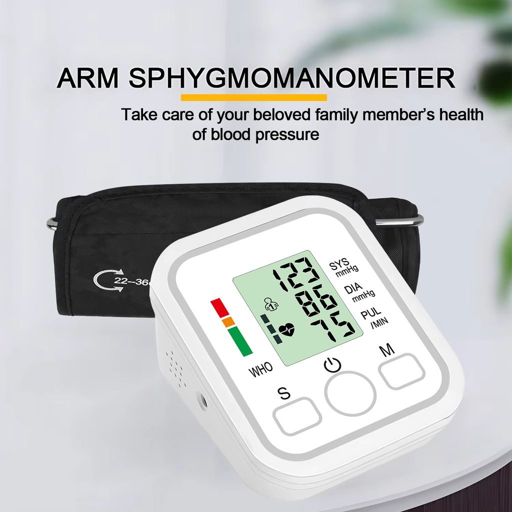 Upper arm blood pressure monitor cuff with digital display on a table